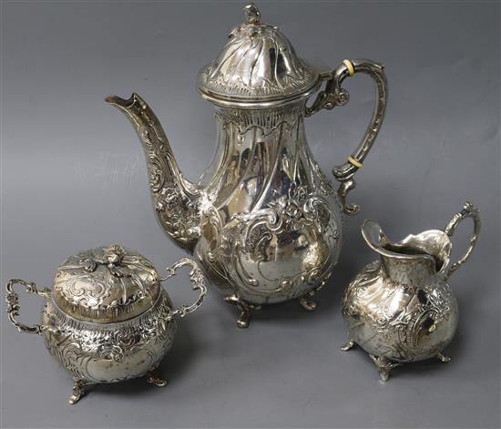 A late 19th century German 800 standard white metal three piece coffee set, gross 20 oz.